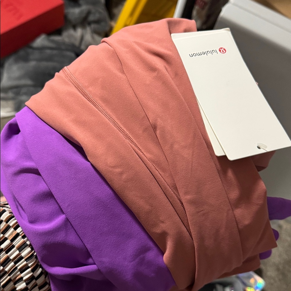Two Lululemon pants split him purple and pink